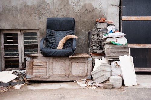 Clearance team sorting furniture in Earlscourt